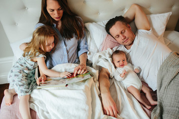 Family together in bed