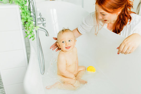 Mother with baby in bath