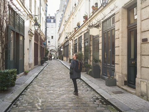 Woman standing in alley