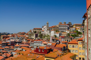 Fototapeta na wymiar View on the roofs and steeples of Porto