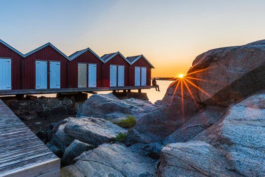 Boat huts at sunset