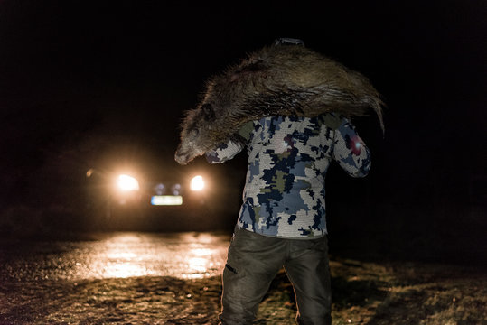 Hunter with boar
