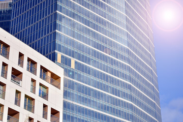 Modern office building detail, glass surface with sunlight. Business background. 
