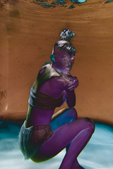 Very Strange photos of an alien girl underwater with bubbles in the negative.