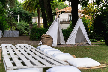 Small tipi indian tent with pillows in the woods © Ivan Castro