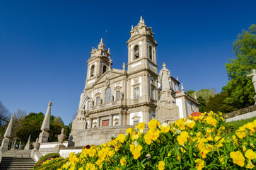 Sanctuary of Bom Jesus do Monte with a yellow flowers under a blue sky