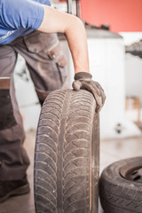 Car master vulcanizer replaces and changes old with new tires © guruXOX