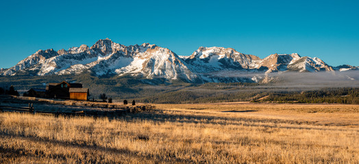 Sawtooth mountains in Idaho with house in foreground