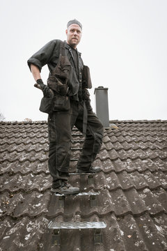 Chimney sweep on roof