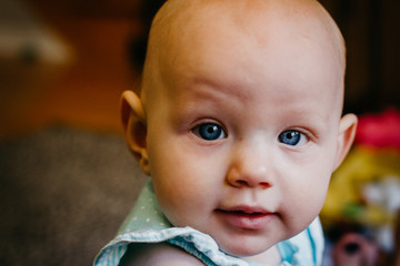 smiling happy baby with grey background