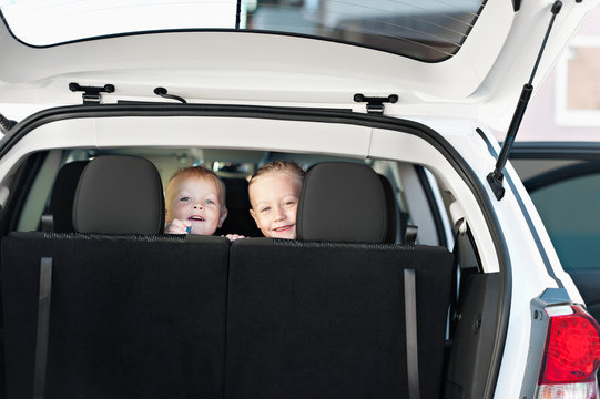 Smiling boy and girl in car