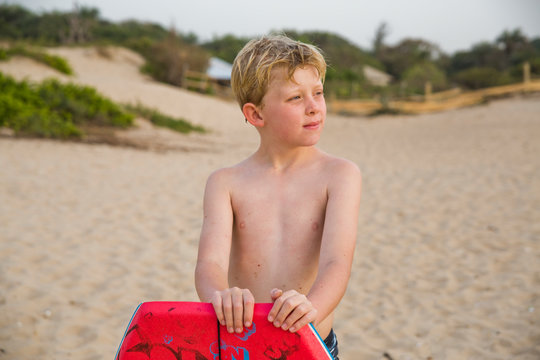 Boy on beach looking away