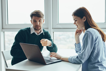 Fototapeta premium couple working on laptop in office