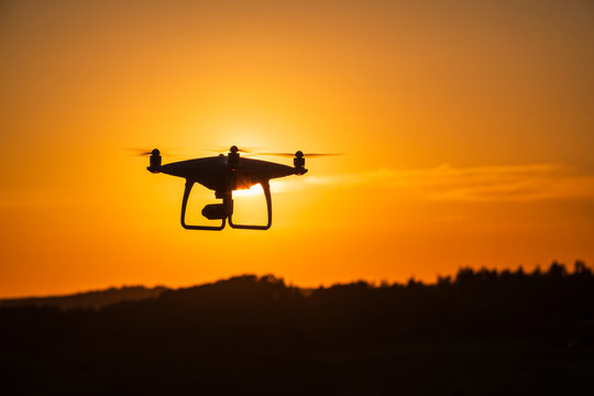 Silhouette of drone at sunset