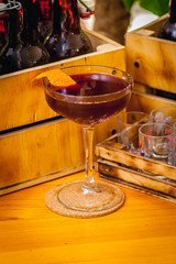 Beautiful bright cocktail on a brown wooden table. Summer refreshing drink.