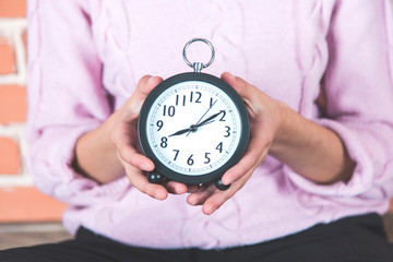 woman hand clock