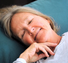 Mature female beauty expressions in bed.