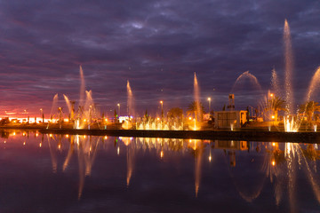 Fototapeta na wymiar Beautiful fountain at sunset day on exposure in the city of Batumi, Georgia.