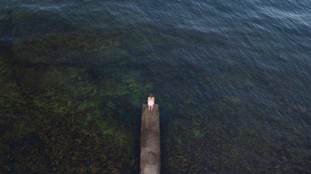 Woman standing on jetty