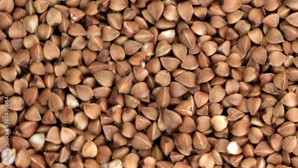 Poster grocery video screen saver, rotating buckwheat background closeup top view using zoom and move the c