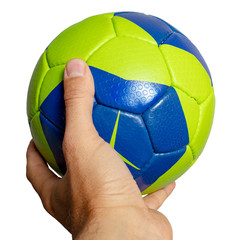 Handball ball in hand closeup on a white background