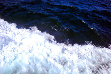 The waves in the blue sea