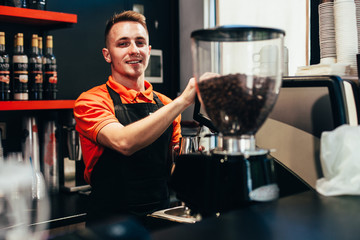 Barista makes delicious coffee in a coffee shop