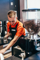 Barista makes delicious coffee in a coffee shop