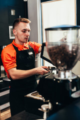 Barista makes delicious coffee in a coffee shop
