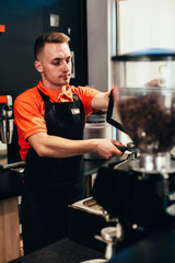 Barista makes delicious coffee in a coffee shop