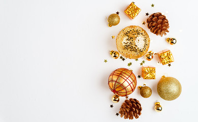 christmas golden background, christmas decoration, cones, balls, glitter, flat lay