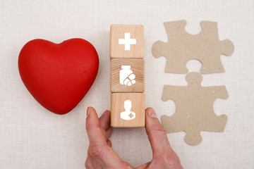 Doctor hand arranging wood block stacking with icon healthcare, insurance for your health.