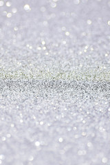 Silver defocused glitter backround.