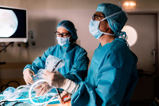 Professional medical team performing surgery in hospital