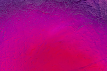 Beautiful bright colorful street art graffiti background. Abstract creative spray drawing fashion colors on the walls of the city. Urban Culture, pink, red, orange, , green, crimson, purple texture