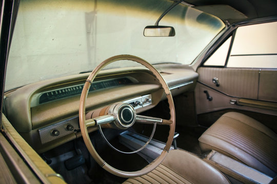 Old, classic car inside a garage