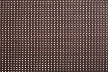Wicker background texture plastic furniture. Plastic weaving texture. Brown plastic weave for background.