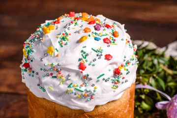Easter cake and colorful eggs on a dark background
