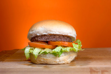 Take-Away foods on Orange vibrant background colour and wood