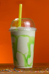 Take-Away foods on Orange vibrant background colour and wood