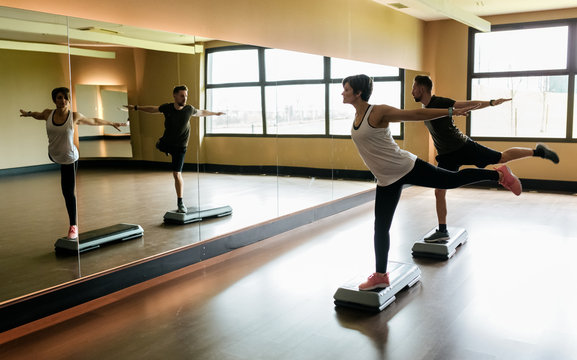 Couple practicing step indoors