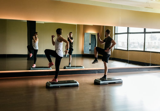 Couple practicing step indoors