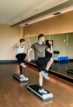 Couple practicing step indoors