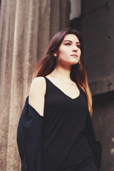 Fototapeta premium Model in black dress and long jacket. Style. Fashion trends 2020. Hair with ombre. Business lady. Blogger. Work