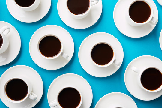 Cups on saucers filled with coffee