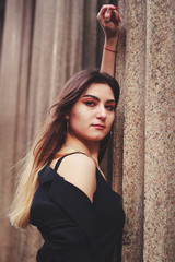 Fototapeta premium Model in black dress and long jacket. Style. Fashion trends 2020. Hair with ombre. Business lady. Blogger. Work