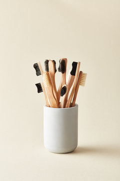 Cup with wooden toothbrushes