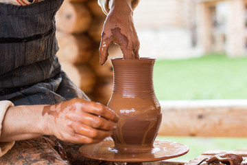 Hands of potter making the pot. 