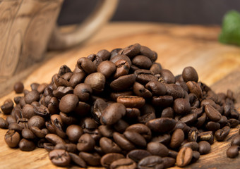  coffee beans on a wooden board