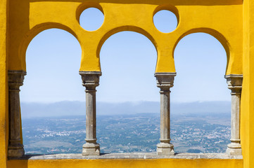 The view through the arabian style arches of the Terrace to the surroundings of Pena Palace.